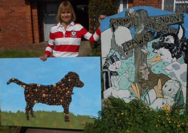 Artist Tina Finch delivers The Chocolate Labrador to Paws Animal Sanctuary