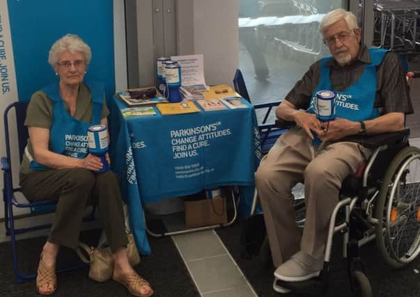 Kate and Gordon Brine, members of the Worthing and district branch of Parkinson's UK, manning an information point
