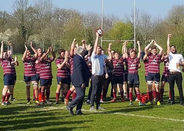 Crawley Rugby Club lift the Sussex League trophy SUS-171004-210450002