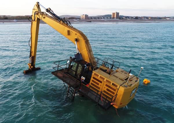 The digger is currently stranded off the Worthing coast