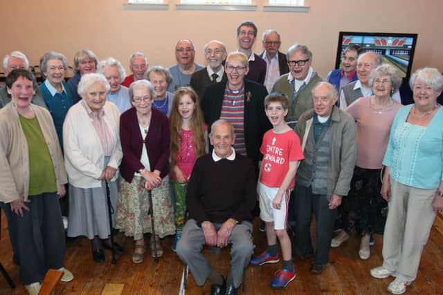 Ted King, centre, celebrates his 102nd birthday with friends at Offington Park Methodist Church. Picture: Derek Martin DM17418560a