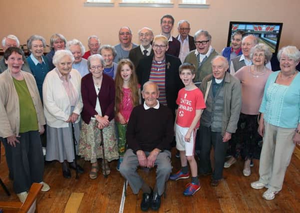 Ted King, centre, celebrates his 102nd birthday with friends at Offington Park Methodist Church. Picture: Derek Martin DM17418560a