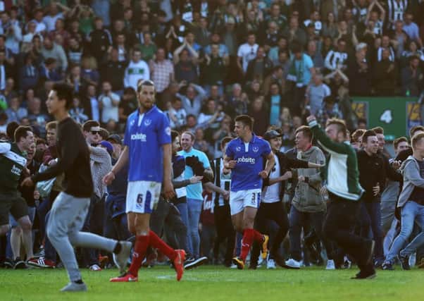 Enda Stevens surrounded by partying Plymouth fans after the play-off semi-final defeat last season. Picture: Joe Pepler