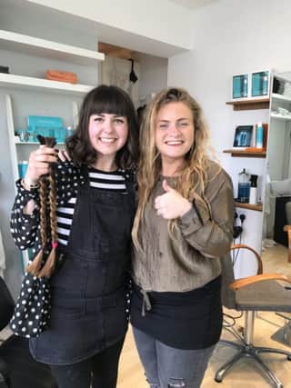 Jessica Brehaut, left, had 17 inches cut off her beautiful long hair at The One Salon in Southwick