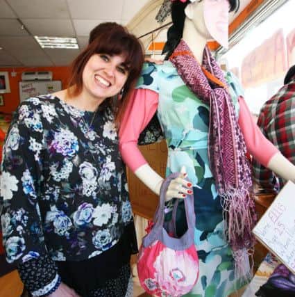 Trainee Ellis Ashe beside a mannequin she dressed as herself. Photo by Derek Martin DM17417665a