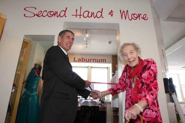 Mrs Gladys Barnard cuts the ribbon to open the new charity shop at the Laburnum Centre, Bognor Regis, accompanied by Bognor Regis mayor Pat Dillon. Photo by Derek Martin DM17418325a