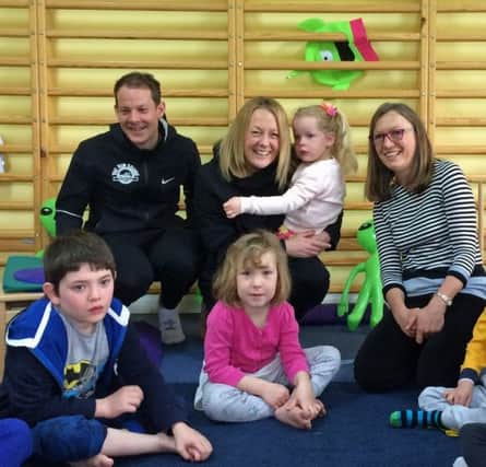 The Run Squad founders Nick and Jo Rivett visit Easter Holiday Club at Whoopsadaisy SUS-170413-141000001