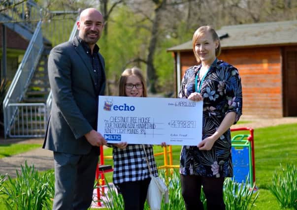 Chestnut Tree House Eastbourne Donation. Mike Gillman, his daughter Mya (10) and Vicky Norman from hospice SUS-170419-094305001