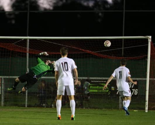South Park goalkeeper Callum Thomas is beaten by Simon Johnson's shot for the second Hastings United goal last night. Picture courtesy Scott White
