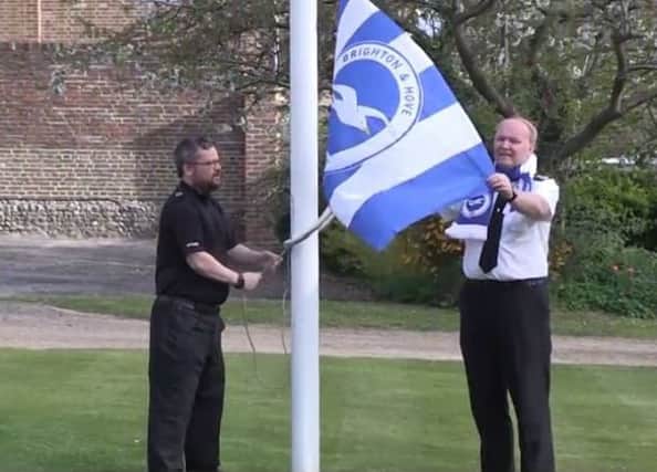 PC Darren Balkham and Chief Constable Giles York of Sussex Police raising the Albion flag at the police headquarters in Lewes