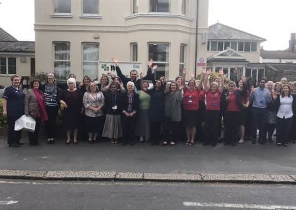 Staff celebrating being rated 'outstanding' by the CQC