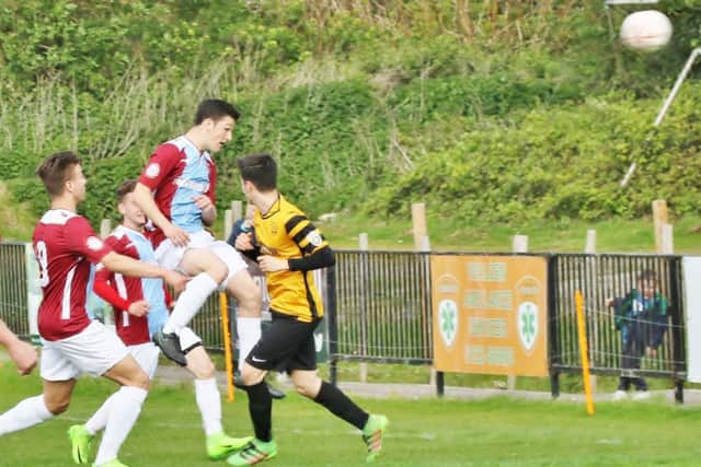 Tom Climpson rises highest to head Hastings United in front. Picture courtesy Joe Knight
