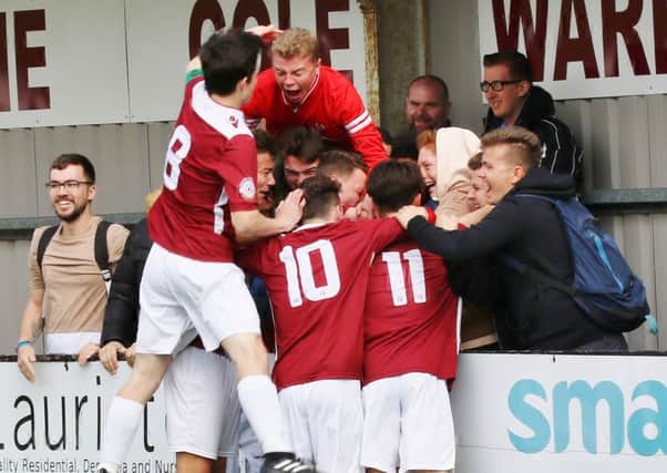 Hastings United players and supporters celebrate scoring against Maidstone. Picture courtesy Joe Knight