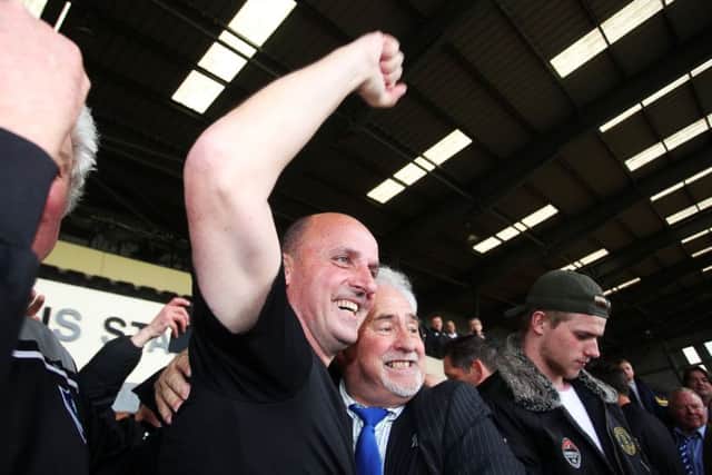 Paul Cook celebrates with Iain McInnes. Picture: Joe Pepler