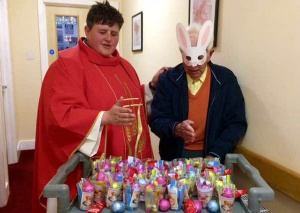 The Rev Tash Emin blessed the  Easter treats that were gifted to every resident