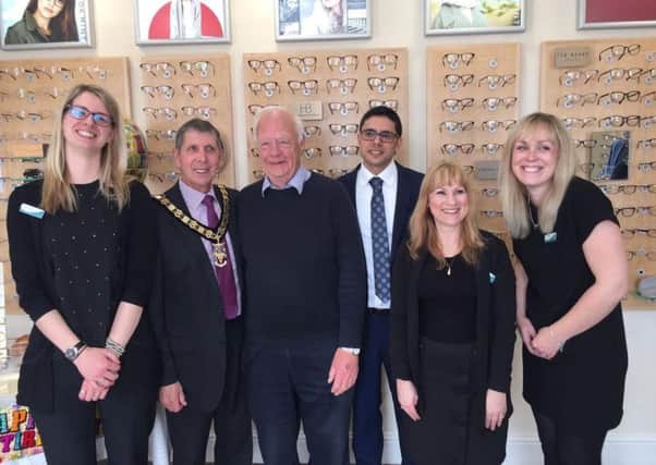 Chris of Walsh Opticians with staff and the mayor