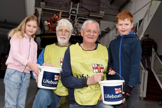 Easter event at Hastings Lifeboat Station.
Eden and Seb Arnold with lifeboat volunteers Alan Hurrell and Richard Beattie. SUS-170415-142236001