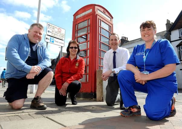 Members of Horsham Community Responders who are raising money to convert the phone box into a defibrillator station. 
Jon Fisher (Surrey Fire and Rescue), Hilary Humphrey ( volunteer and trustee of Horsham Community Responders), Peter Maskell from Brock Taylor, and nurse Andrea Ward. Pic Steve Robards SR1707425 SUS-170415-172756001