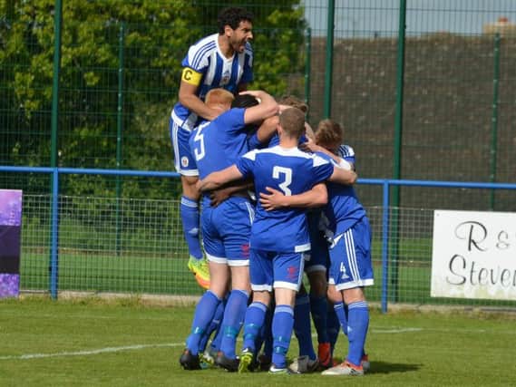Celebrations for Melford Simpson's goal. Haywards Heath Town v Eastbourne Town. Picture by Grahame Lehkyj