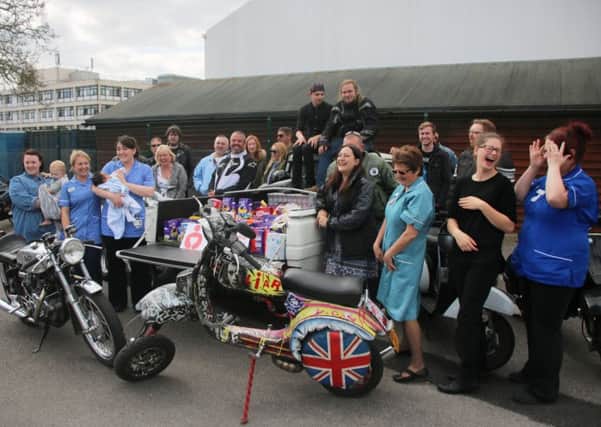 Nurses from the wards come out to meet the bikers and scooterists. Picture: John Holden