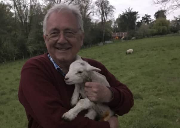 Sir Peter with a newborn lamb