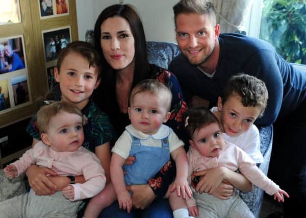 Rachel Ballard and Kris Moyse with their triplets (from L to R) Pollyanna, William and Penelope, and Rachel's two boys Jacob and Harrison.ks170848-1 SUS-170419-184122008