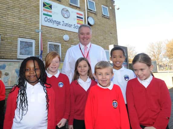 Head Teacher Mr Reynard and pupils from Ocklynge Junior School in Eastbourne (Photo by Jon Rigby) SUS-160112-104408008