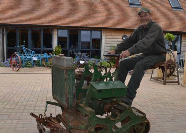Museum curator and charity founder Clive Gravett on a rare 1920s Ransomes mower at the Budding Foundation's Museum of Gardening