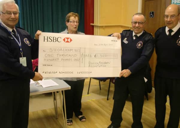 A cheque for Â£1,300 was presented to Shoreham National Coastwatch Institution by Eleanor Millward, newly-elected chairman of Goring Residents Association, at the group's annual meeting