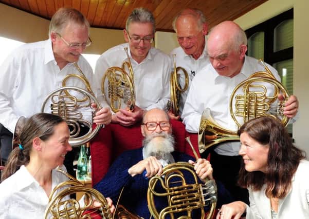 Farquharson Cousins, centre, celebrating his 100th birthday with his daughter Jane Diment, front right, and members of the Vienna Horns Scotland, some of which he taught. Picture: Kate Shemilt ks170856-1