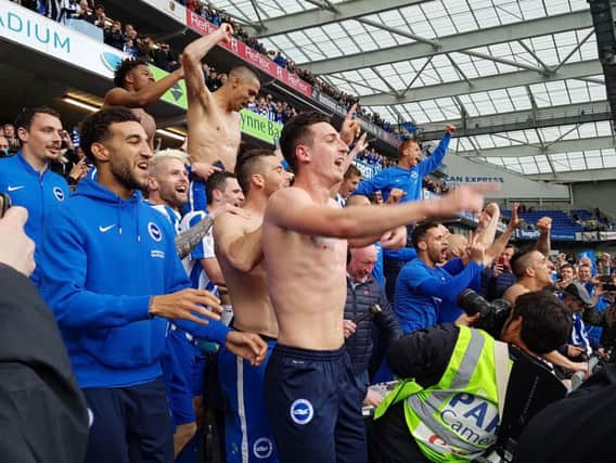 Albion players celebrate promotion on Monday.