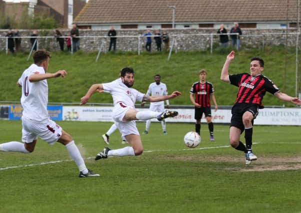 Ollie Rowe scores Hastings United's third equaliser in Monday's 4-4 draw away to Lewes. Picture courtesy Scott White