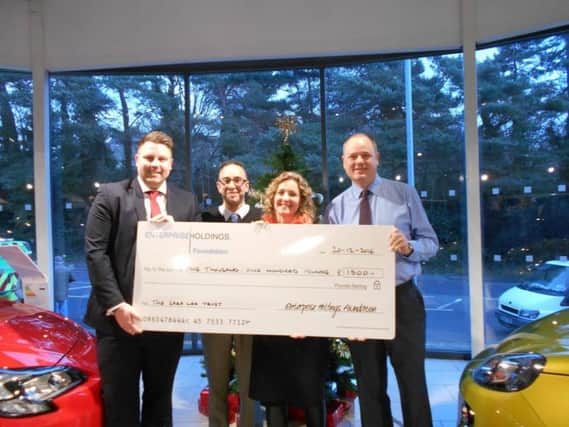 SLM Vauxhall donates cheque to Sara Lee Trust SUS-170421-131958001