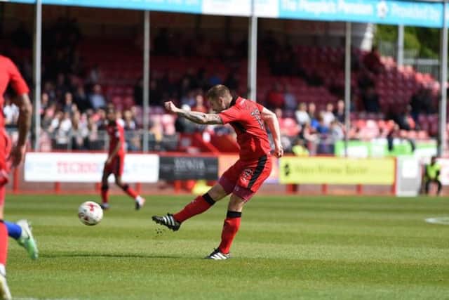 Crawley Town fires in a brilliant opening goal from outside the area.
Picture by PW Sporting Photography