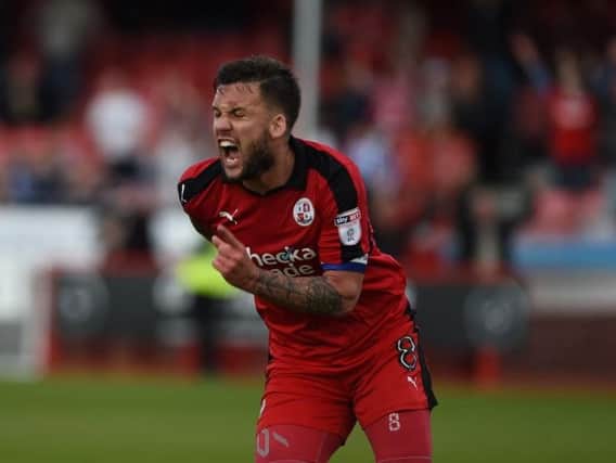 Crawley Town skipper Jimmy Smith celebrates scoring Reds' third goal in their 3-3 draw at home to Carlisle which earnt the point which secured their League 2 status.
Picture by PW Sporting Photography