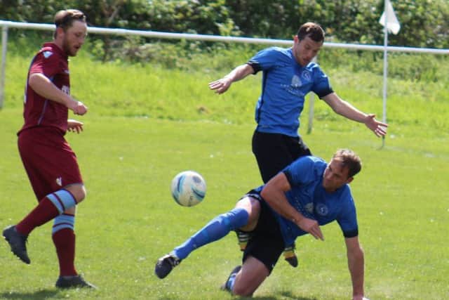 Jamie Crone is denied by some determined defending in Midhurst's box. Picture courtesy Catherine Gurney