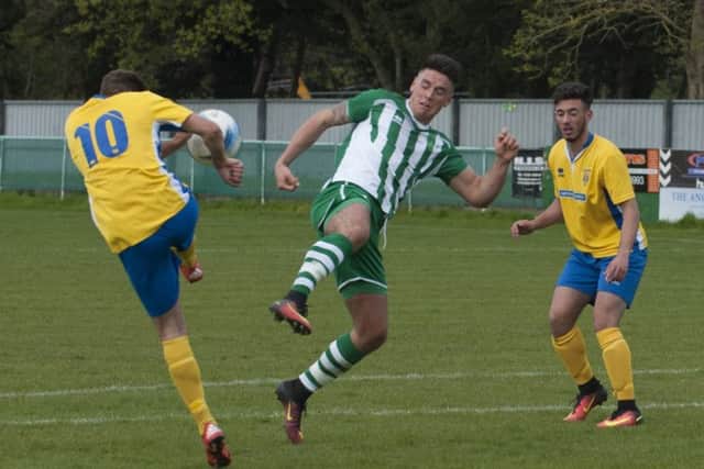 Action from Chichester City's tussle with Lancing / Picture by Tommy McMillan