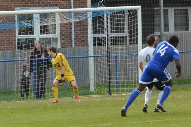 Melford Simpson turns away after scoring. Picture by Grahame Lehkyj
