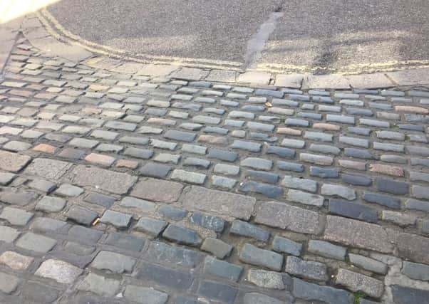 Uneven paving in East Street, where a woman in a wheelchair was injured earlier this month