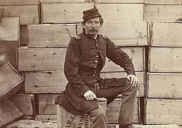 Part of a stereograph showing Union Captain J. W. Forsyth, the Provost Marshall, sitting on a crate of hardtack in 1863 by Hartford, Conn: The War Photograph & Exhibition Co SUS-170424-144518001