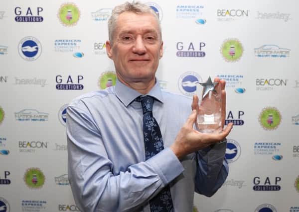 Andrew Lock with his Fan of the Season award at Brighton and Hove Albion FCs Players Awards Dinner on Monday. Picture: Paul Hazlewood (BHAFC)