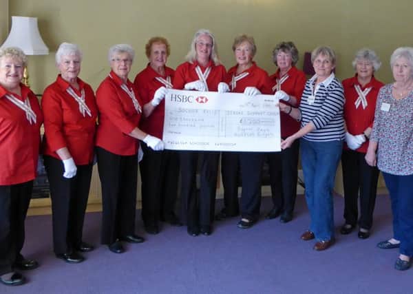 Bognor Regis Handbell Ringers present the Â£1,200 cheque to Valerie Evans, secretary of Bognor Regis Stroke Support Group