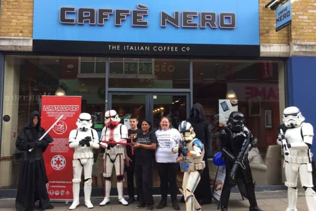 Staff from CaffÃ¨ Nero in Crawley in their striking Star Wars gear. Picture: CaffÃ¨ Nero
