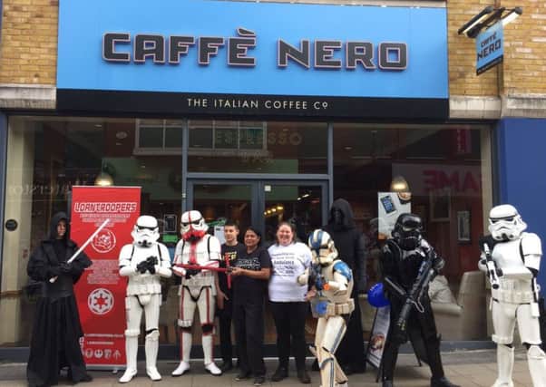 Staff from CaffÃ¨ Nero in Crawley in their striking Star Wars gear. Picture: CaffÃ¨ Nero