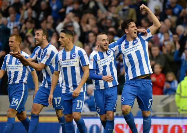 Lewis Dunk (far right) celebrates after scoring against Norwich. Picture by Phil Westlake (PW Sporting Photography)