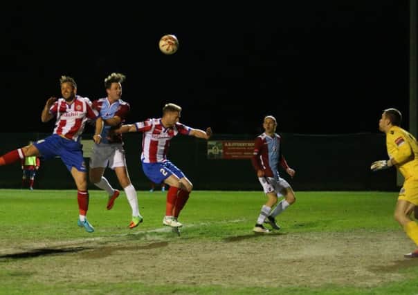 Frannie Collin heads Hastings United in front against Dorking Wanderers. Picture courtesy Scott White