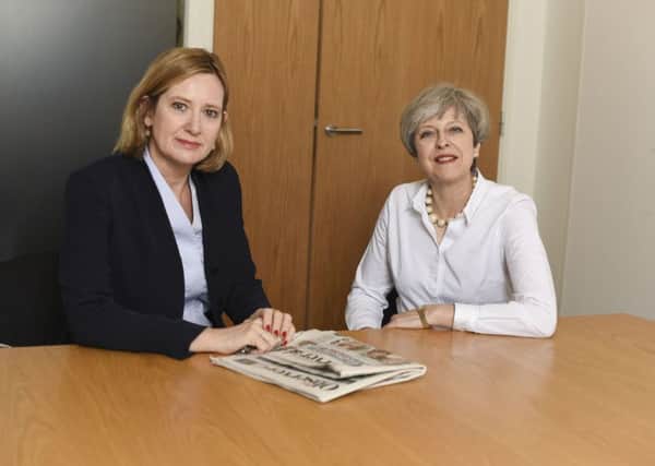 Ms Rudd pictured with the Prime Minister, Theresa May