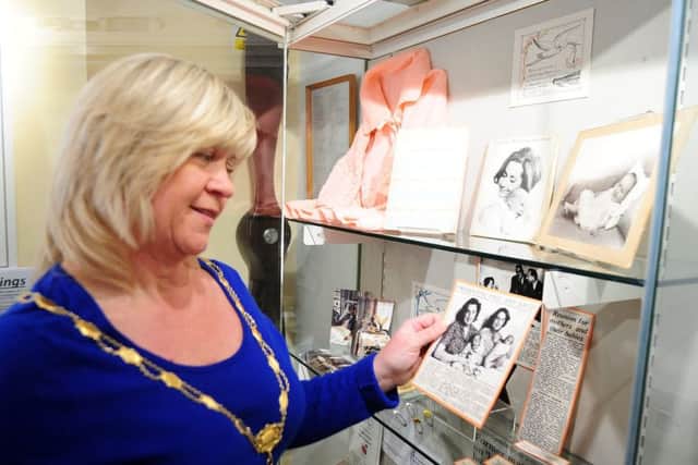 Alison Cooper, chairman of the parish council looking at the exhibits  ks170853-3