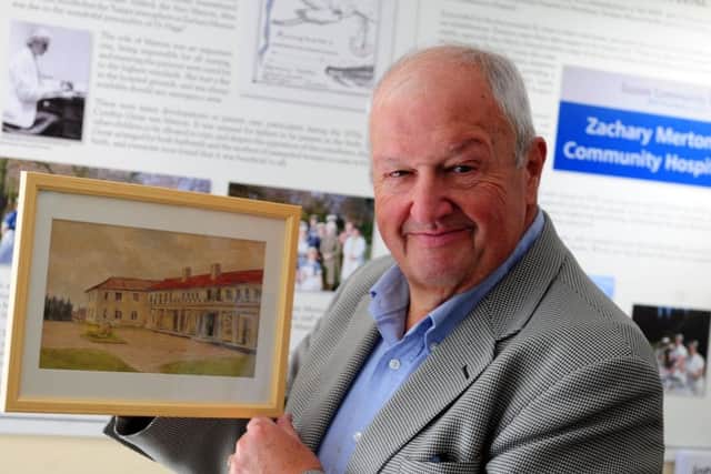Graham Tyler, chairman of the museum management committee, with a drawing of the old hospital  ks170853-4