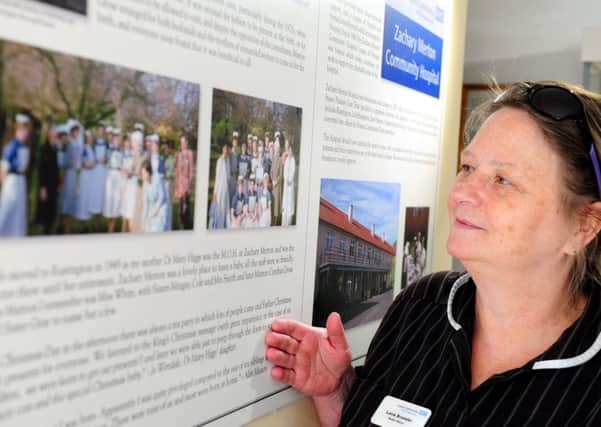 Present day matron at the hospital, Lucie Brumder, looking at the exhibition  ks170853-6